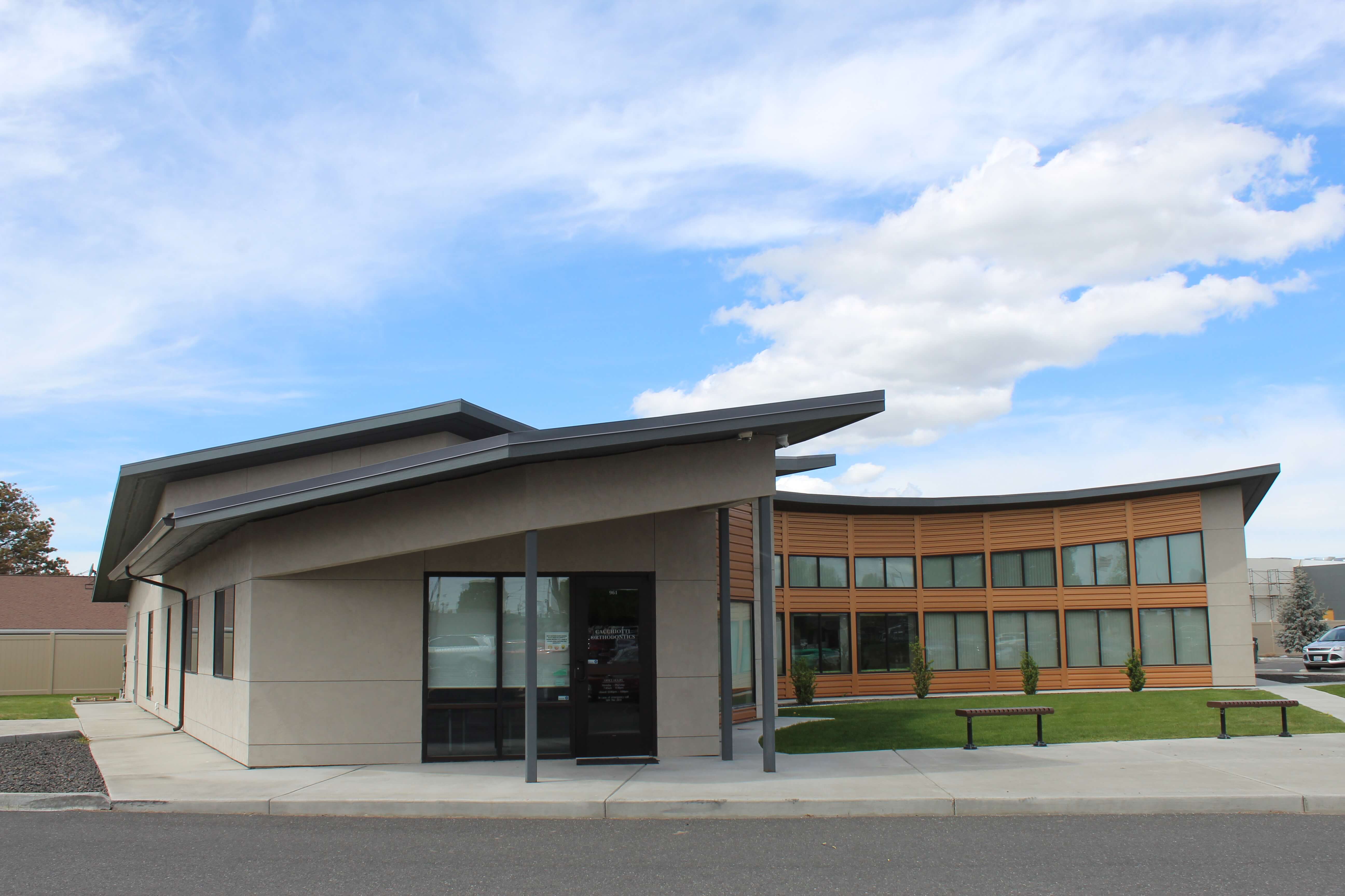 Cacchiotti Orthodontics modern commercial building with curved roofline, structural engineering by JSL Engineering in Moses Lake, Washington